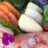 Sashimi Deluxe · 12 pieces of sashimi and rainbow roll.
