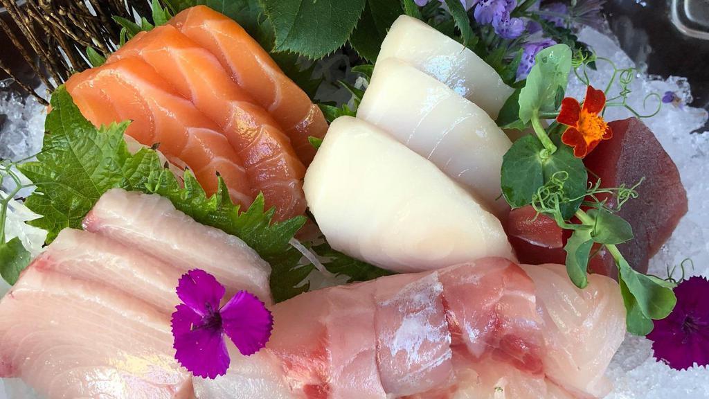 Sashimi Deluxe · 12 pieces of sashimi and rainbow roll.