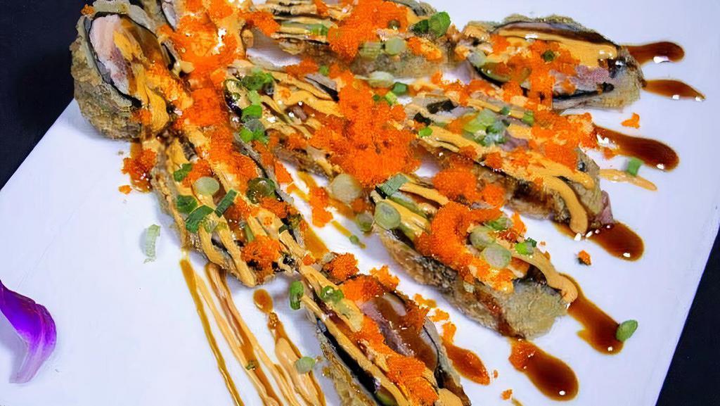 Peacock Maki Roll · Tuna, salmon, white fish, asparagus tempura, no rice, tempura encrusted, topped with scallion, masago, kabayaki sauce and spicy mayo.