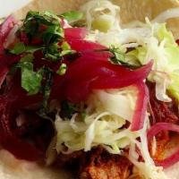 Cochinita Pibil Tacos · YUCATAN-STYLE SHREDDED PORK | WHITE CABBAGE | PICKLED ONIONS | HABANERO | CILANTRO