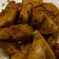 Fried Artichoke Hearts · Tender artichoke hearts coated in seasoned breadcrumbs and fried until golden brown.  Served...