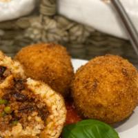 Arancini · Two crispy, deep fried Sicilian rice balls with a meat sauce filling and breadcrumb crust.
(...