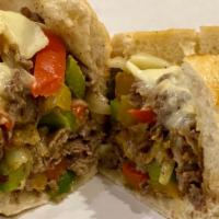 Philly Cheese Steak · Philly Cheese Steak with peppers, onions, mushrooms and topped with provolone cheese.