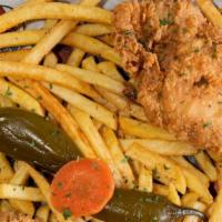 2 Piece Chicken Combo · A fried chicken thigh and leg with a side of fries