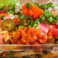 Raw Fries · Bed of Fries topped with Marinated Ahi Tuna & Salmon - Spicy Tuna - Crab -Cilantro - Jalapeñ...