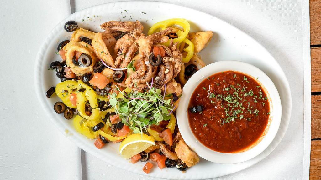 Calamari · Lightly breaded, sautéed with olives, banana peppers, garlic, tomatoes, served with marinara