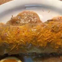 Burrito · Egg, hash browns, sausage & cheese, wrapped and smothered in homemade green chili & cheese.