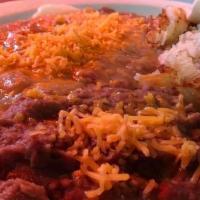 Huevos Rancheros · Two eggs, smothered in homemade green chili & cheese, with hashbrowns, refried beans & torti...