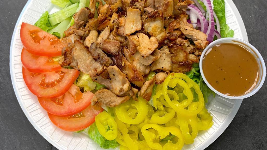 Chicken Shawarma Salad · Includes lettuce, tomatoes, cucumber, banana peppers, and onion.