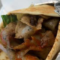 Beef Shawarma Wrap · Top menu item. Includes lettuce, tomatoes, and onions.