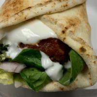 Falafel Wrap · Top menu item. Includes lettuce, tomatoes, and onions.