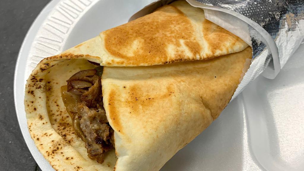 Steak & Cheese Pita Wrap · Steak and cheese with green peppers. mushrooms, and onions.