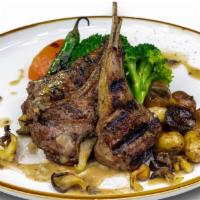 Lamb Chops · 3 Piece Char-grilled olive oil and herb marinated lamb chops topped with creamy mushroom sau...