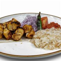 Chicken Skewer · Seasoned and marinated chicken skewer. Served with side of rice and house salad