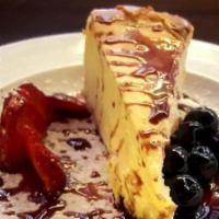 D'Marcos' Cheesecake · Thick New York style, with Frangelico-berry sauce.