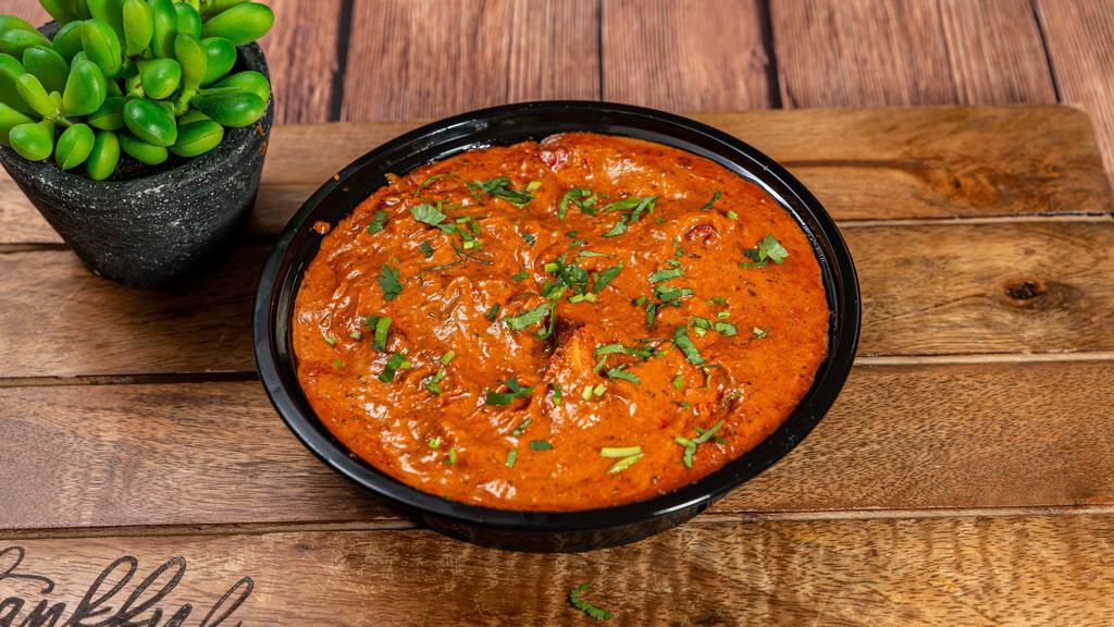 Chicken Tikka Masala · Boneless pieces of tandoori chicken cooked with spices in a butter sauce.