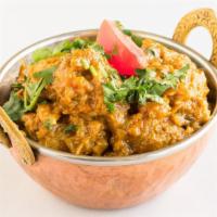 Chicken Curry · Fresh chicken pieces cooked with Indian herbs.
