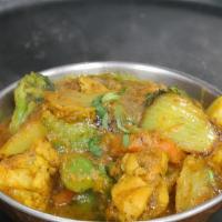 Chicken Jalfrezi · Boneless chicken cooked in butter with fresh slices of cauliflower, potatoes, carrots, green...