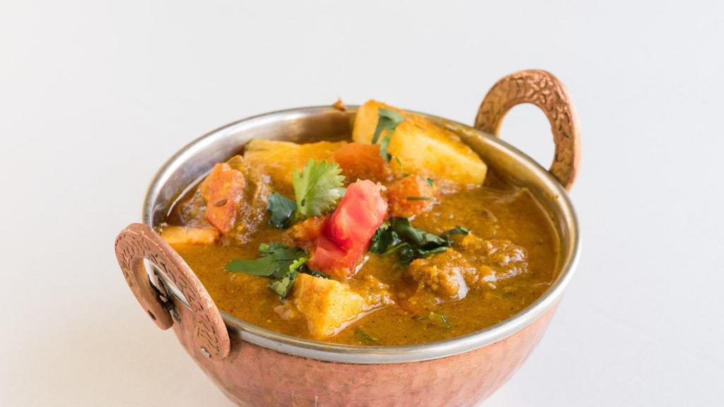 Lamb Vindaloo · Tender lamb pieces and potatoes cooked in a highly spiced curry sauce.