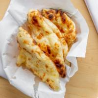 Traditional Naan · Simple but delicious unleavened flat bread cooked in the clay oven.