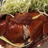 Peking Duck · Seasoned duckling slowly grilled over an open fire until the skin is golden and crispy. The ...