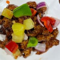 Sweet Vegetarian Ribs · Chunks of ribs mixed with pineapple chunks, red bell pepper, green pepper and red onion.