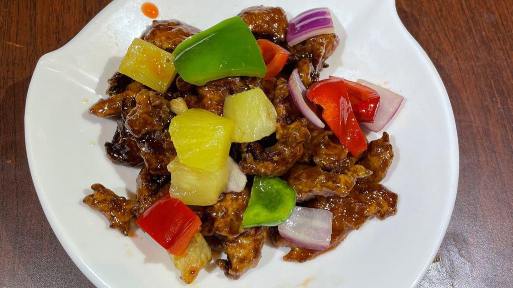 Sweet Vegetarian Ribs · Chunks of ribs mixed with pineapple chunks, red bell pepper, green pepper and red onion.