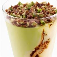 Pistachio Coppa · Custard gelato cup swirled with chocolate and pistachio ice cream topped with praline pistac...
