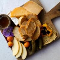 Personal Cheese Board · board includes crostini, fresh fruit, preserves, house made pickles, and local honey