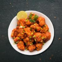 Street-Style Gobi Manchurian · Cauliflower flowerets, seasoned, batter fried and sauteed with green onions and an Indo-Chin...