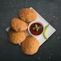 Deep Fried Quiche · A spicy snack with mixture of moong dal and other lip smacking spices, deep fired to form a ...