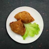 The Love Triangle (Samosa) (2 Pcs) · Triangle shaped deep-fried pastry dumplings filled with spiced potatoes and vegetables serve...