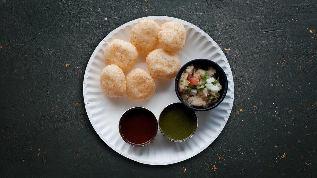 Balls Of Fury · Popular bite-size chaat consisting of a hollow, crispy-fried puffed ball that is filled with potato, chickpeas, onions, spices, and flavoured water, usually tamarind or mint.