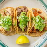 3 Street Mini Tacos  · 3 street mini tacos on corn tortilla served with guacamole, onions and cilantro

Options:  c...