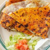Spicy Jack Quesadilla · Chipotle Smothered tortilla, your choice of Grilled Chicken or Carne Asada, jack cheese gril...