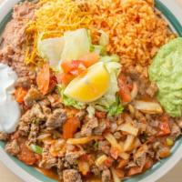 Bistek Ranchero · Rice and beams on the side with lettuce guac sour cream and choice of corn or flour tortillas.