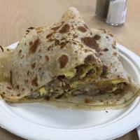 Meat Lovers Breakfast Quesadilla · Eggs bacon sausage ham beans and cheese.