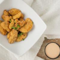 Fried Avocados · Sliced avocados battered in masa and deep fried, served with our chipotle aioli.