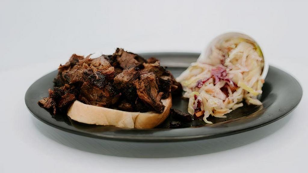 Burnt Ends Or Brisket + 1 Side · Burnt Ends, or Brisket served over a slice of bread with your choice of a side.