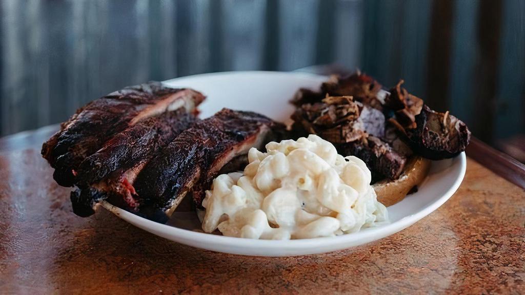 3 Ribs & 1 Meat & 1 Side · 3 slow smoked St. Louis style spareribs served with your choice of Pulled Pork, Chicken, Sausage, Ham, Turkey, Burnt Ends, or Brisket served over a slice of bread with your choice of a side.