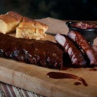 Full Rack Of Ribs & 1 Side · Twelve slow smoked St. Louis style spareribs served on a slice of bread with your choice of ...