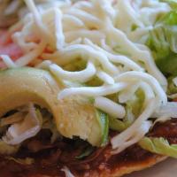 Tostadas De Asada / Steak Tostadas · Se sirven con lechuga, tomate, queso, aguacate y frijol. / Served with lettuce, tomatoes, ch...