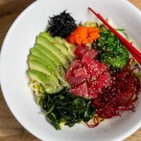 Poke Bowl · (Choice of Salmon or Tuna) Mixed with House Spicy Sauce Served over Garden Vegetables, Onion...