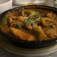 Chicken Karahi · Succulent boneless chicken cooked with tomatoes, onions, green peppers, ginger, garlic and c...