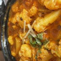 Alu Gobi · Cauliflower and potatoes cooked with spices.