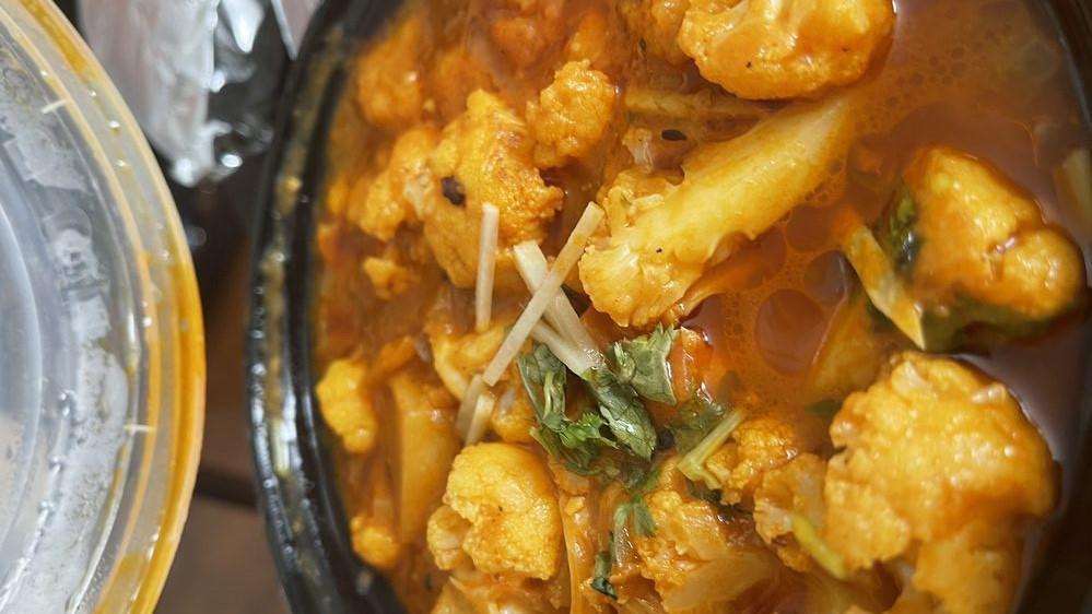 Alu Gobi · Cauliflower and potatoes cooked with spices.