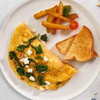 Spin The Spinach & Feta Omelette · Eggs, spinach, and feta cheese cooked as an omelette. Served with home fries and toast.