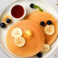 Banana Of Angels Pancakes · Fluffy banana pancakes cooked with care and love served with butter and syrup. Served in pai...