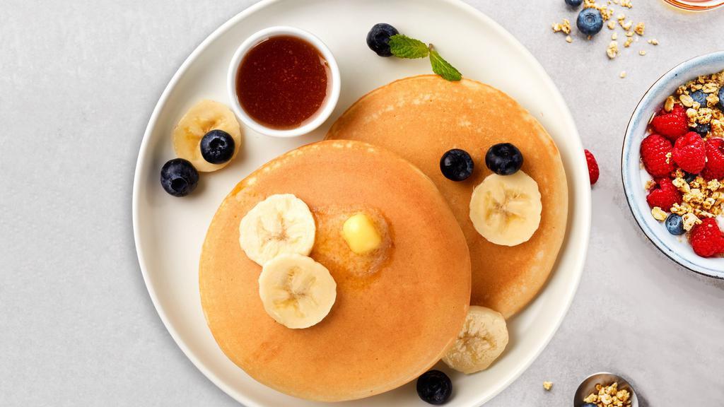 Banana Of Angels Pancakes · Fluffy banana pancakes cooked with care and love served with butter and syrup. Served in pairs.