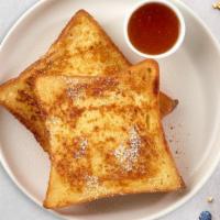 City Of Cinnamon Toast · Three slices of bread toast with cinnamon.